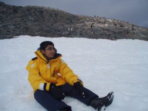 Teenager sitting in Antarctic snow