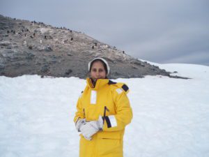 Woman posing in front of penguins