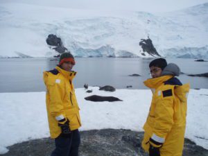 Kids in front of Antarctic landscape
