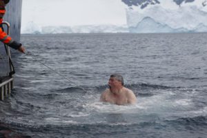 Cold man jumping into Southern Ocean