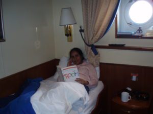 Woman in bed reading Room