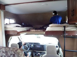 Beds above driver's seat in caravan