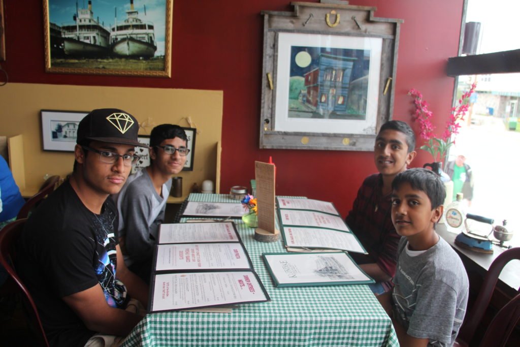 Friends sitting at restaurant table