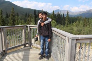 Man hugging son in Tombstone Park
