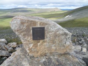 A rock with a plaque denotating Wright Pass, named after pioneer Allen A. Wright  