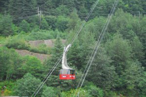 Mt Roberts Tramway going above forest on cable line in Alaska