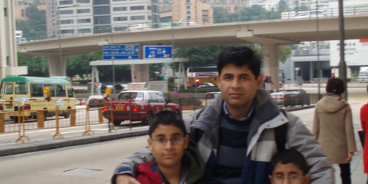 Man with two boys in Hong Kong